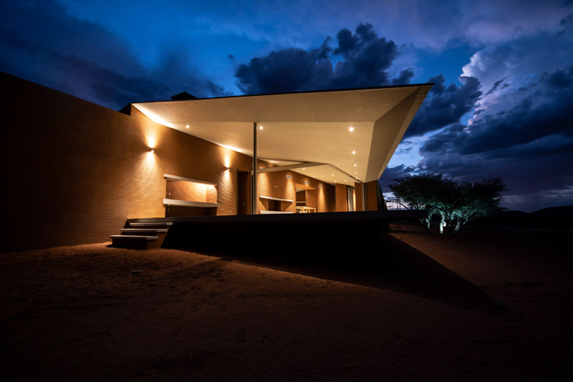 slee & co. architects' red earth game lodge emerges from the namibian landscape - 5