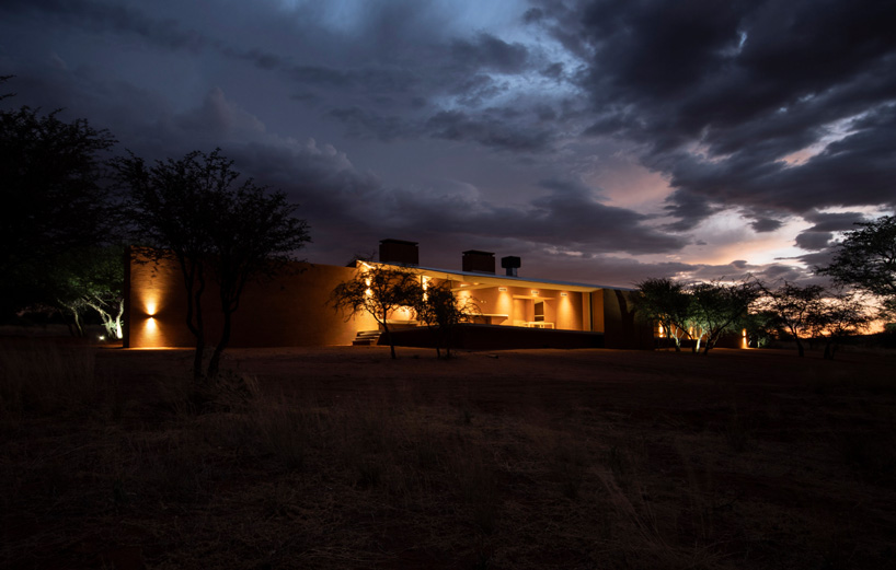 slee & co. architects' red earth game lodge emerges from the namibian landscape - 6