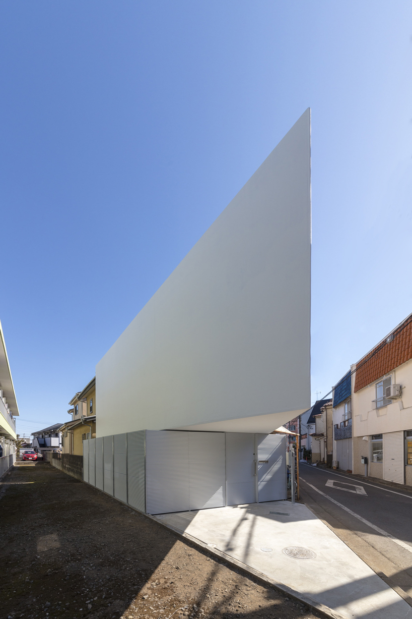 narrow cantilevered volume defines international royal architecture 's spiral house in tokyo