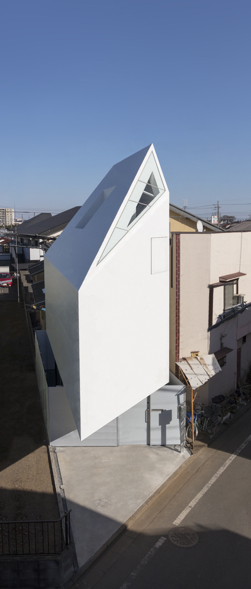 narrow cantilevered volume defines international royal architecture 's spiral house in tokyo