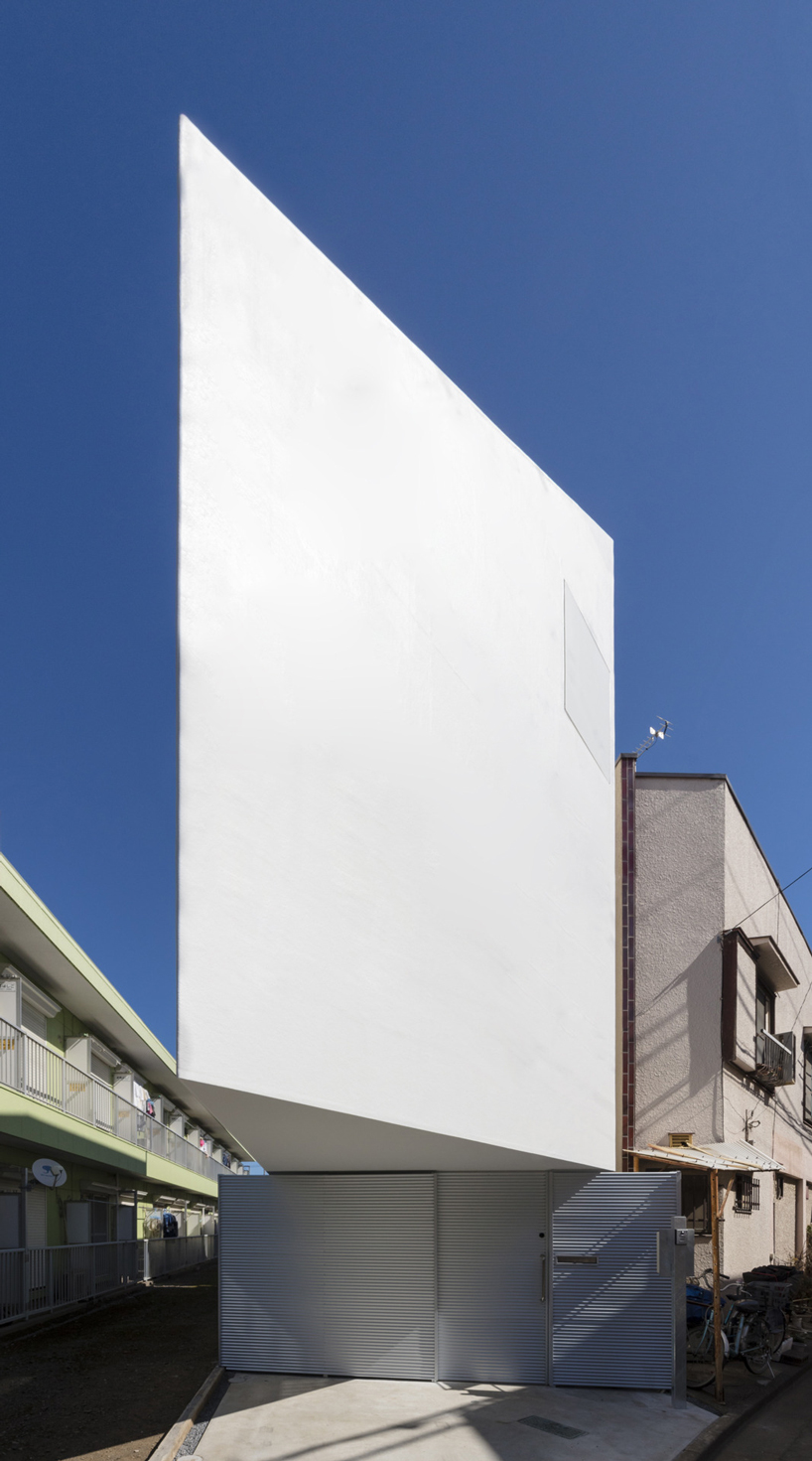 narrow cantilevered volume defines international royal architecture 's spiral house in tokyo