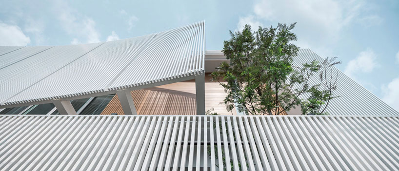 TOUCH architect clads 'house enfold' with a curved shading device in thailand designboom