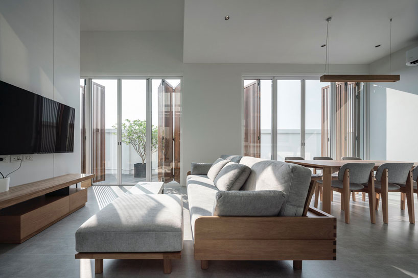 TOUCH architect clads 'house enfold' with a curved shading device in thailand designboom