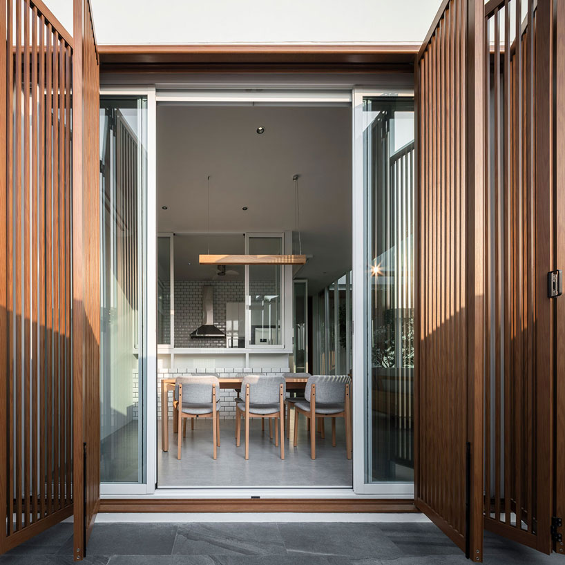 TOUCH architect clads 'house enfold' with a curved shading device in thailand designboom