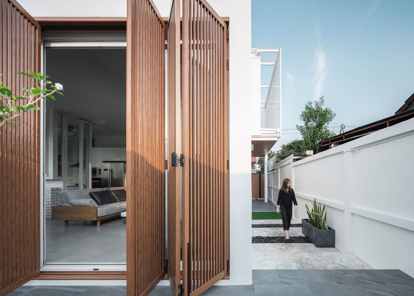 TOUCH architect clads 'house enfold' with a curved shading device in thailand designboom