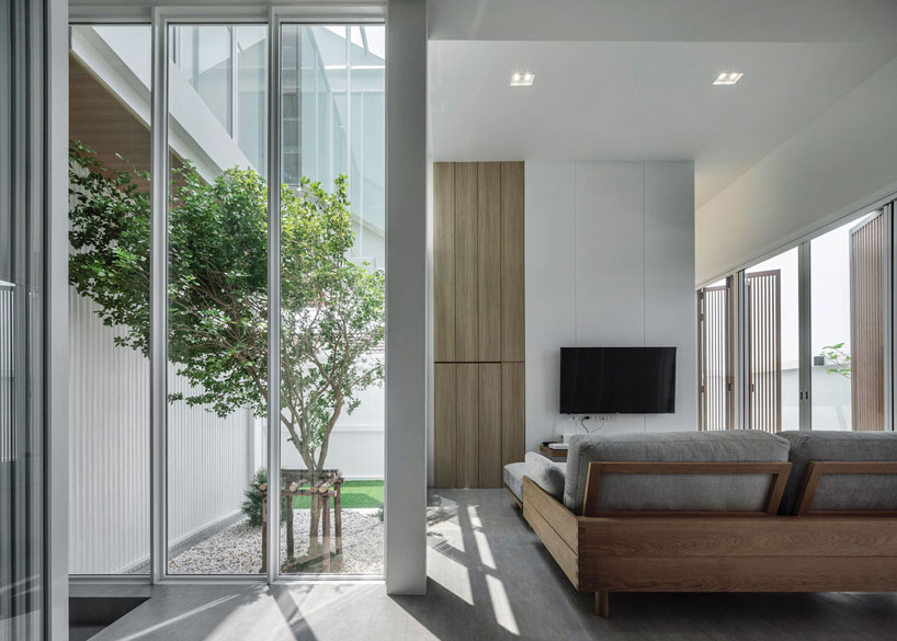 TOUCH architect clads 'house enfold' with a curved shading device in thailand designboom