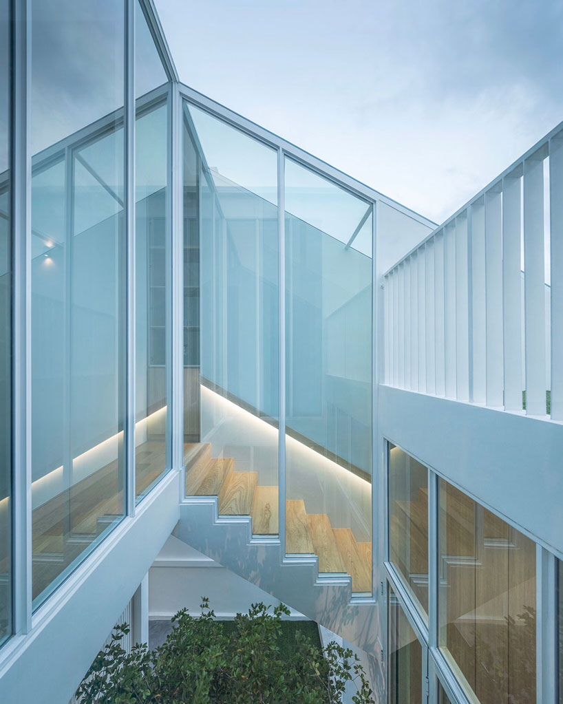 TOUCH architect clads 'house enfold' with a curved shading device in thailand designboom