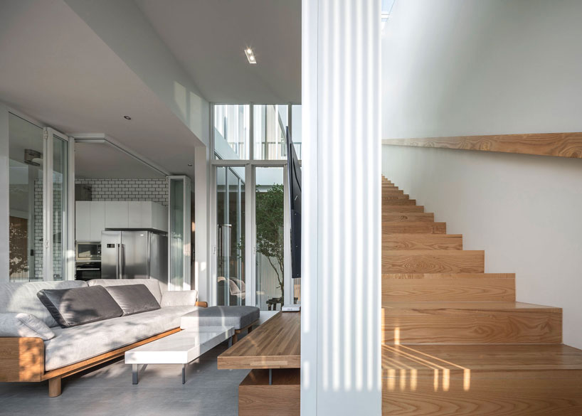 TOUCH architect clads 'house enfold' with a curved shading device in thailand designboom