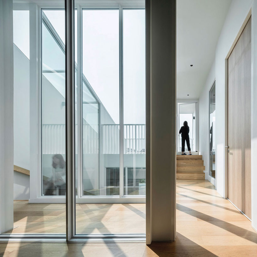 TOUCH architect clads 'house enfold' with a curved shading device in thailand designboom