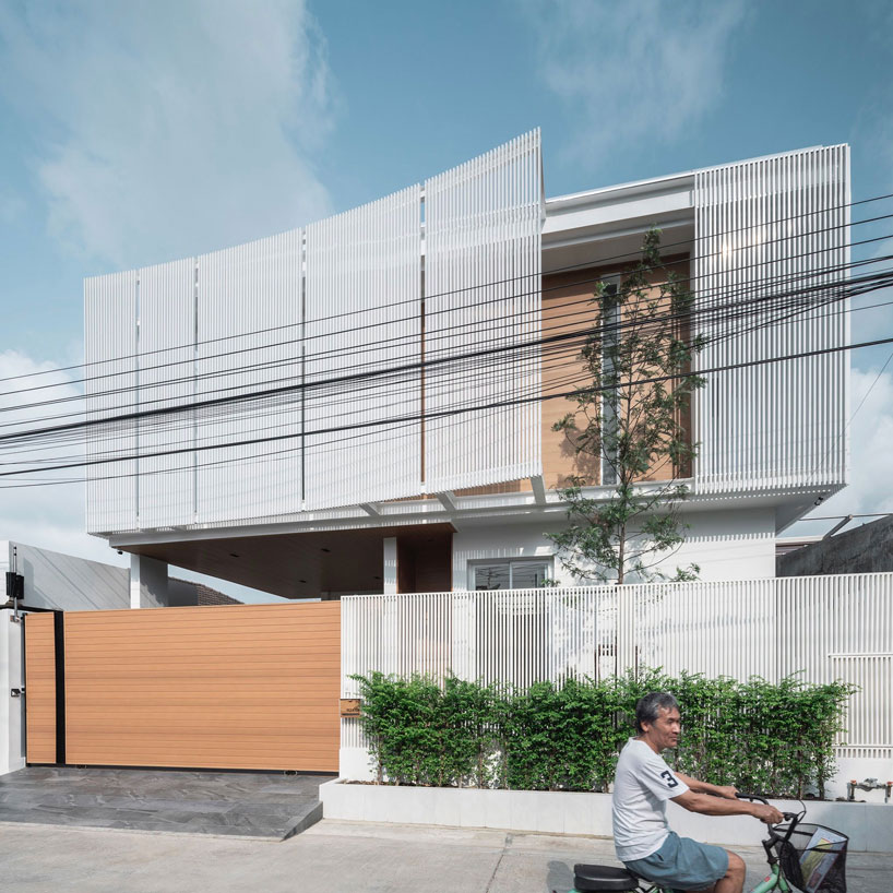 TOUCH architect clads 'house enfold' with a curved shading device in thailand designboom