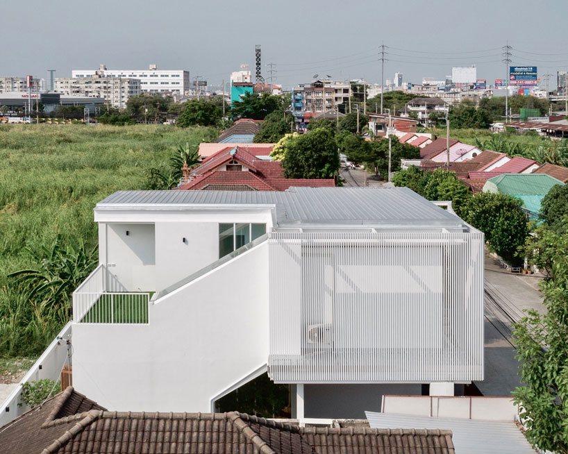 TOUCH architect clads 'house enfold' with a curved shading device in thailand designboom