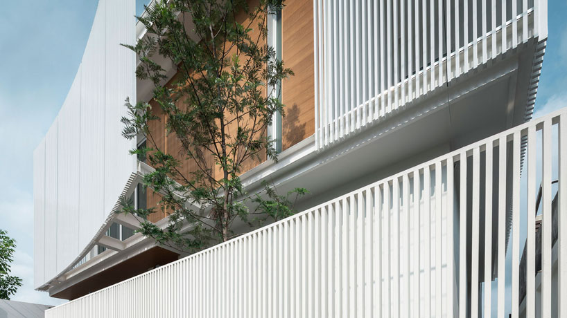 TOUCH architect clads 'house enfold' with a curved shading device in thailand designboom