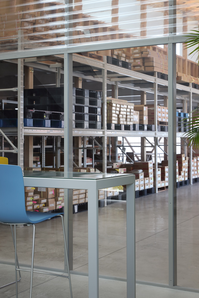 arii irie architects tops light-filled warehouse in ageo, japan, with exposed timber roof truss