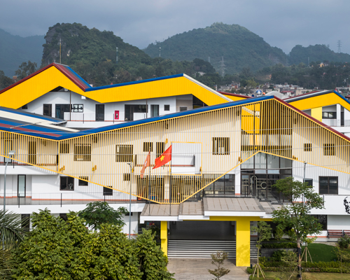 colorful 'da hop school' by 1+1>2 architects echoes mountains of vietnam