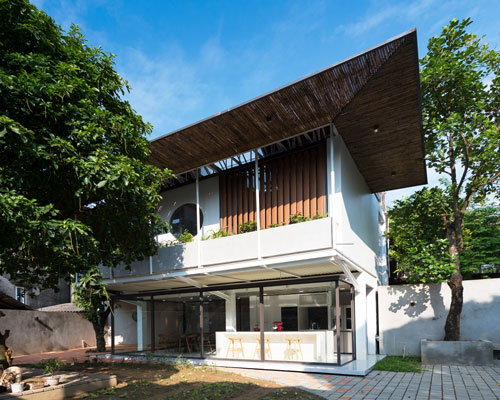 AD+studio builds the 'stacking-roof-house' for a young couple in vietnam