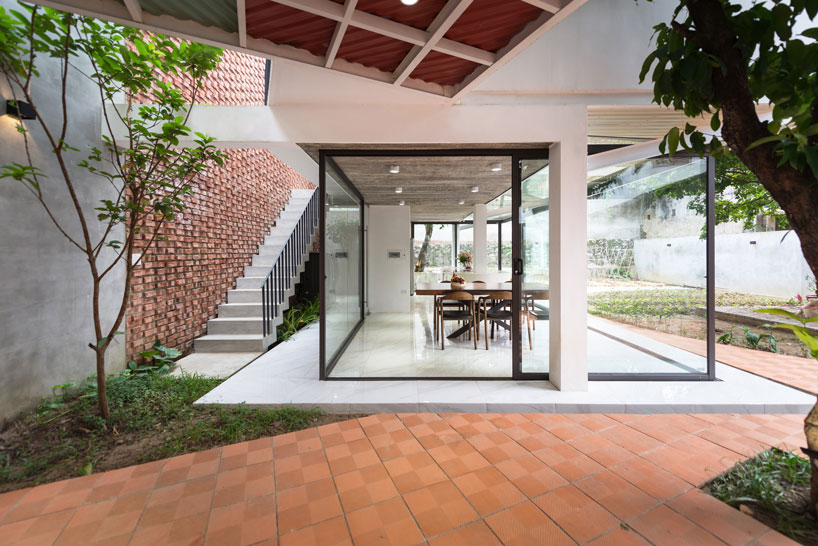 AD+studio builds the 'stacking-roof-house' for a young couple in vietnam designboom