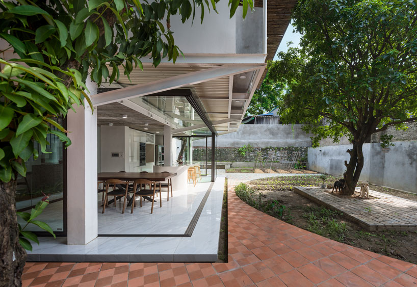 AD+studio builds the 'stacking-roof-house' for a young couple in vietnam designboom