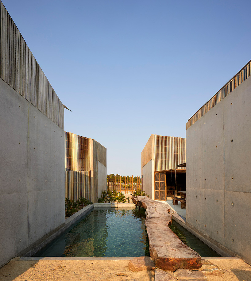 BAAQ' arranges four wood + concrete volumes into 'casa naila' house in oaxaca, mexico