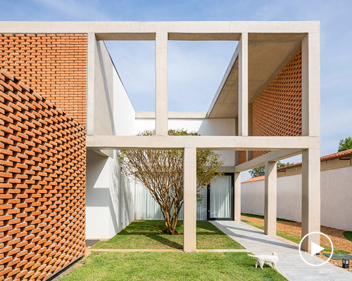 bloco arquitetos utilizes exiting concrete frame to renovate and extend 'casa grid' in brasília