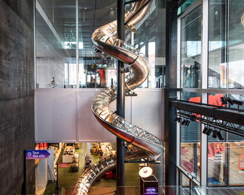 carsten höller installs 40-meter-long slide at the danish architecture center in copenhagen