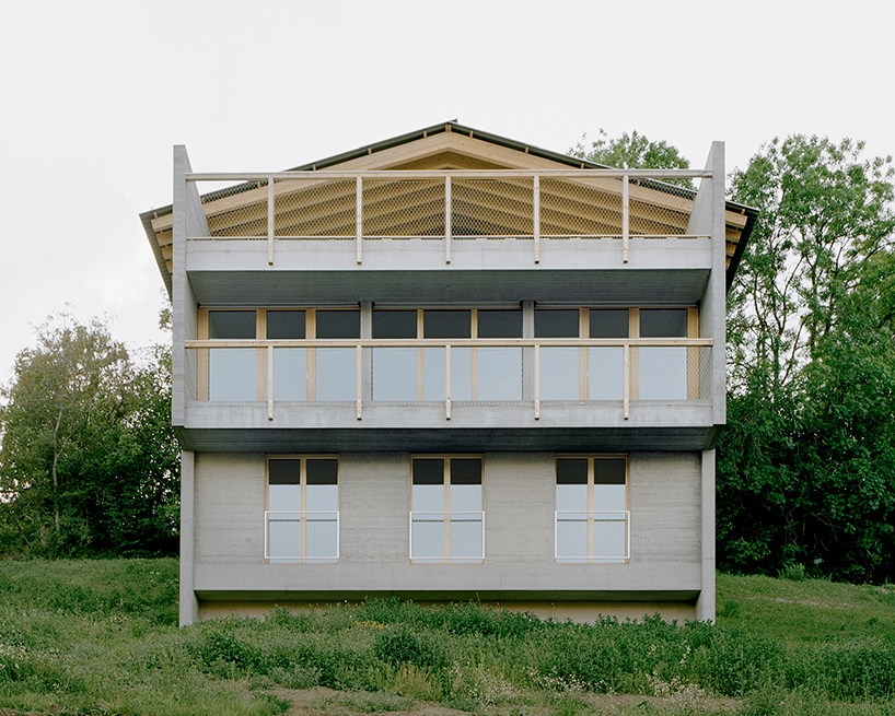 deschenaux follonier's composition of timber and concrete overlooks 'la place'