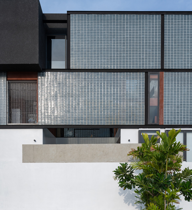 glass block walls bring natural light into archimontage's sena house in bangkok designboom