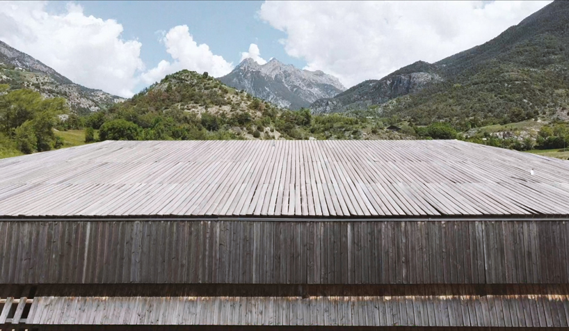 larch cladding folds over gymnasium guillestre to echo the landscape designboom