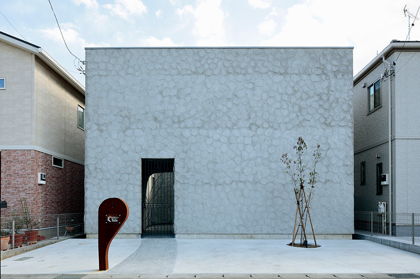 house + dance studio by international royal architecture wraps around open garden in japan