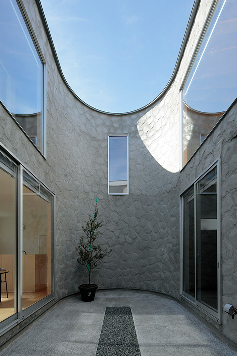 house + dance studio by international royal architecture wraps around open garden in japan