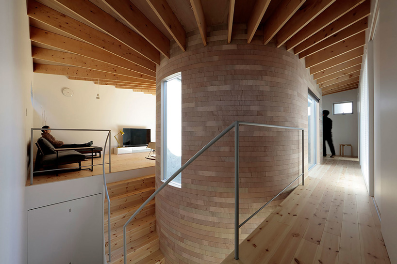 house + dance studio by international royal architecture wraps around open garden in japan