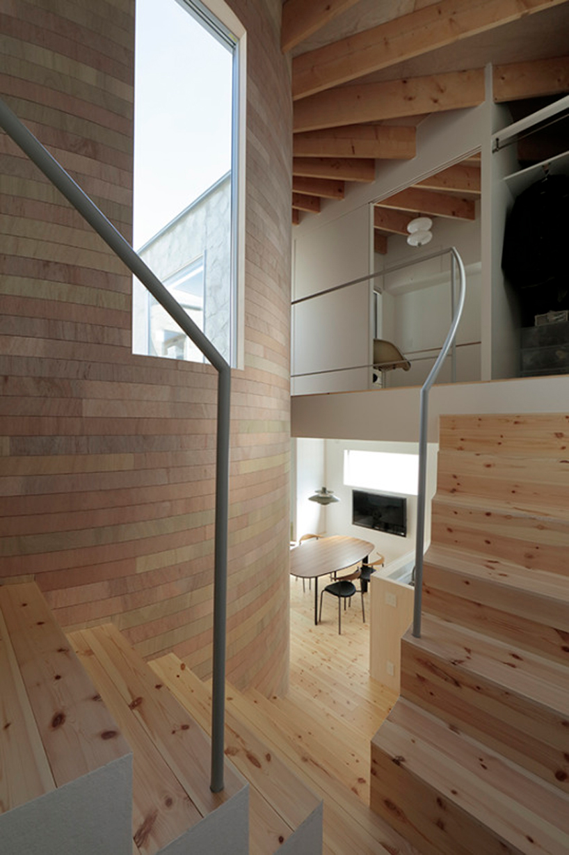 house + dance studio by international royal architecture wraps around open garden in japan