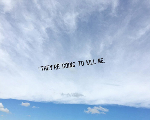 jammie holmes writes george floyd’s final words across the sky of US cities