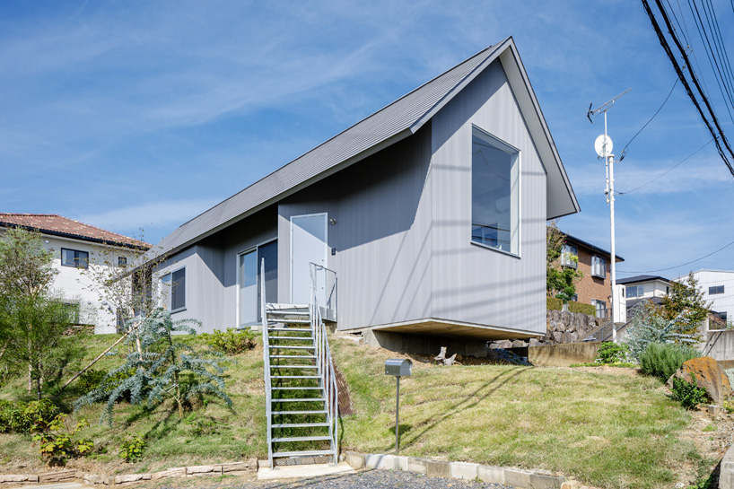 SNARK + OUVI top wooden house in saishikada, japan, with pitched roof