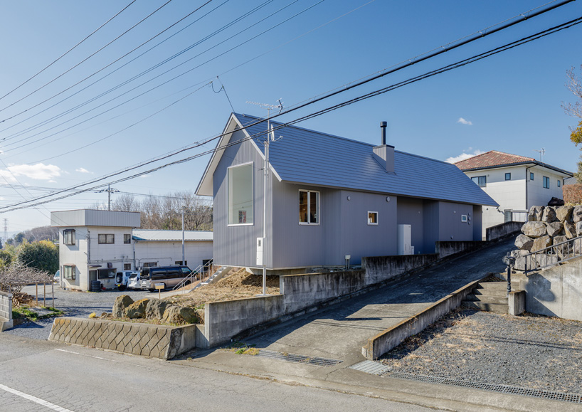 SNARK + OUVI top wooden house in saishikada, japan, with pitched roof