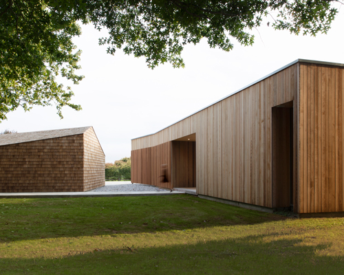 red architecture references japanese culture to design a simple timber home in new zealand