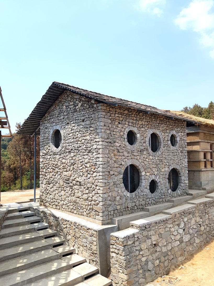 supertecture uses donated bricks from earthquake ruins to extend a school in nepal designboom
