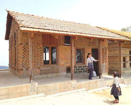 supertecture uses donated bricks from earthquake ruins to extend a school in nepal