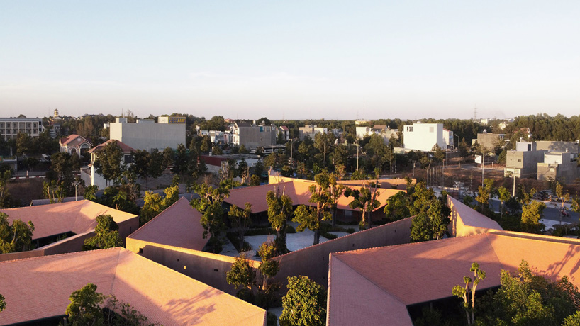 steep-slope roofs top the volumes of TAA design's 'phu my garden' park in vietnam