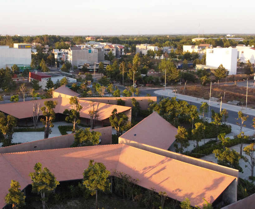 steep-slope roofs top the volumes of TAA design's 'phu my garden' park in vietnam