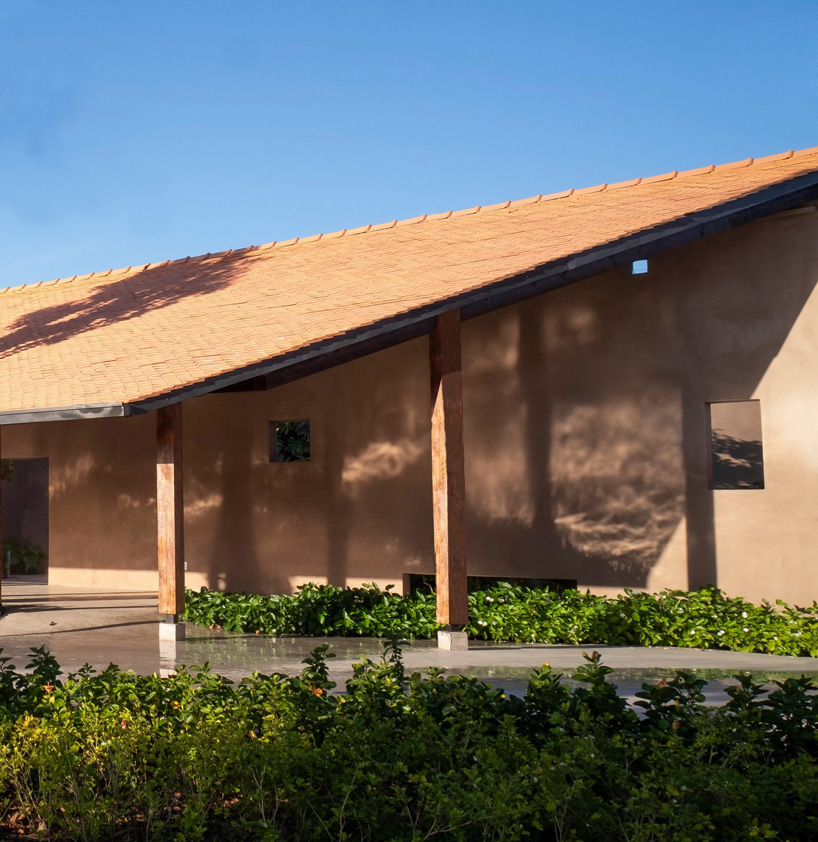 steep-slope roofs top the volumes of TAA design's 'phu my garden' park in vietnam