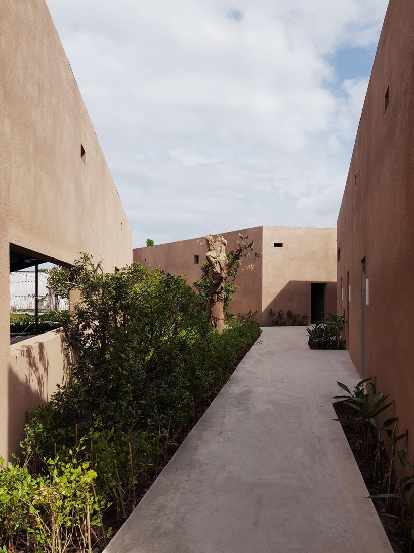 steep-slope roofs top the volumes of TAA design's 'phu my garden' park in vietnam
