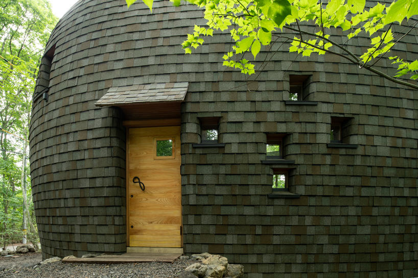organic timber forms blend tono mirai's shell house into a japanese forest designboom