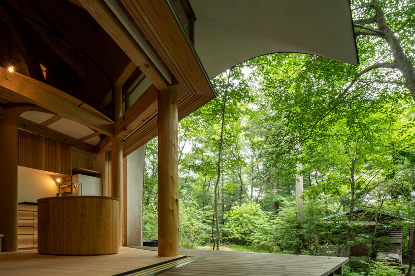 organic timber forms blend tono mirai's shell house into a japanese forest designboom