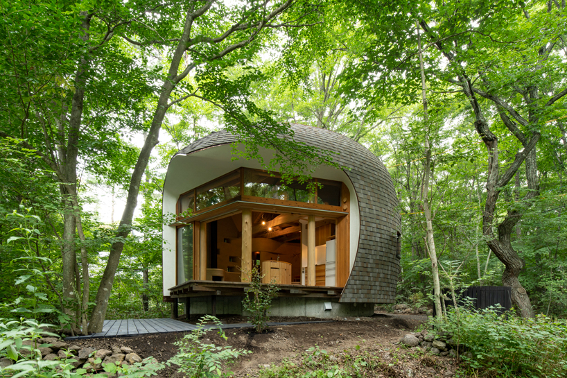 organic timber forms blend tono mirai's shell house into a japanese forest designboom