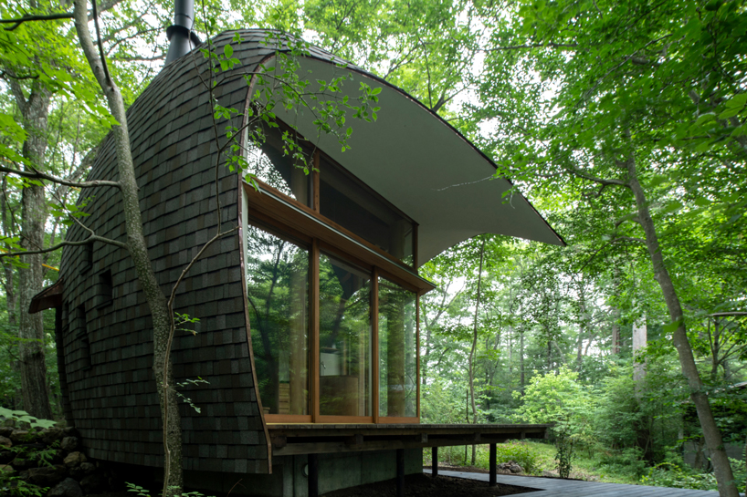organic timber forms blend tono mirai's shell house into a japanese forest designboom