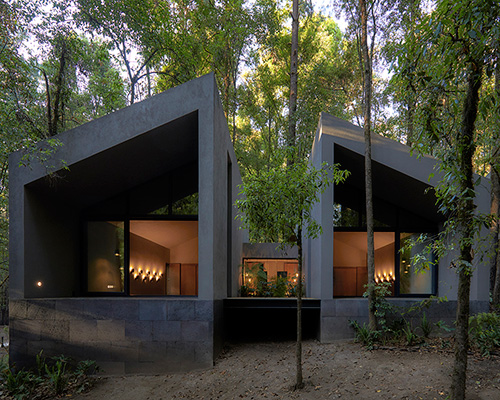 weber arquitectos builds social cabins with volcanic stone in mexican forest