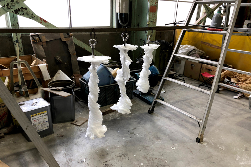 we+ captures the shape of a water vortex to create the 'swirl' light fixture designboom