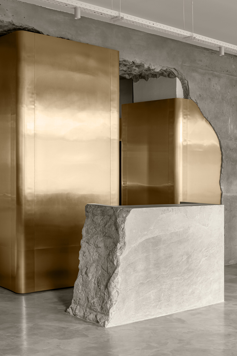 balbek bureau finishes gender-neutral beauty salon in kyiv with concrete arch + gold details