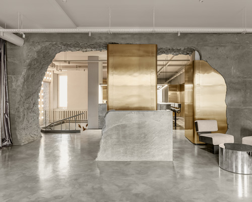 balbek bureau finishes gender-neutral beauty salon in kyiv with concrete arch + gold details