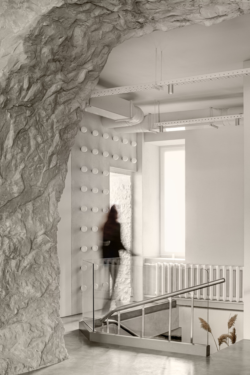 balbek bureau finishes gender-neutral beauty salon in kyiv with concrete arch + gold details